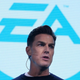 EA CEO Andrew Wilson stands on stage at a video game showcase contemplating his next million.